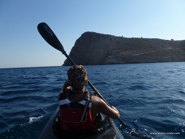 Paddler heading towards Agiofarago rock climbing area